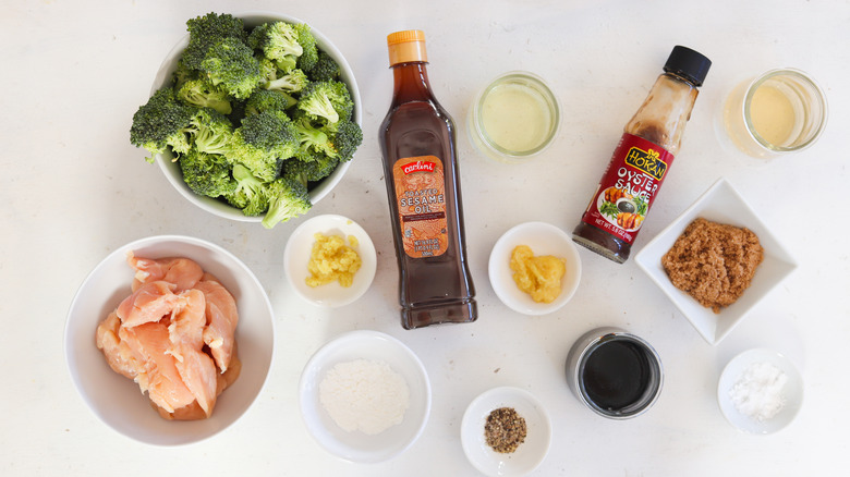 ingredients for chicken and broccoli on white table