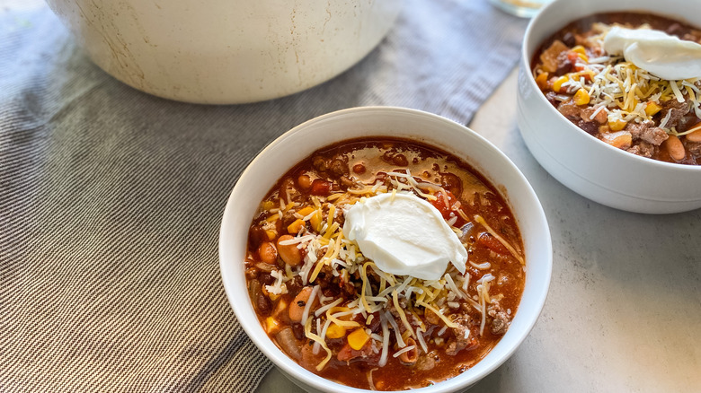 bowl of venison chili with toppings