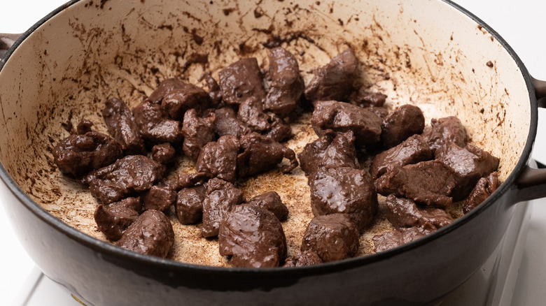 venison browning in a pan