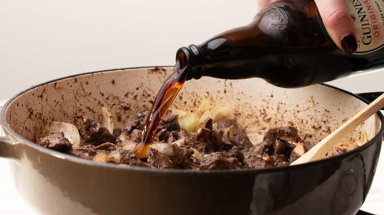 pouring Guinness into a pan