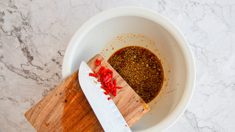 Adding chile to marinade