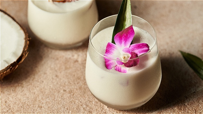 piña coladas with flower garnish