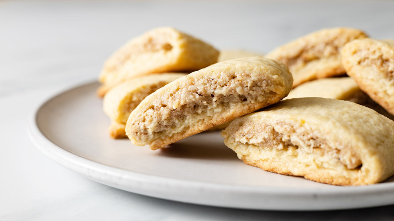 Walnut pillow cookies on a plate