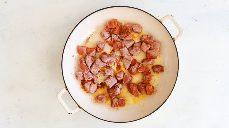 pork cubes in a pan