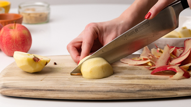 knife cutting through apple