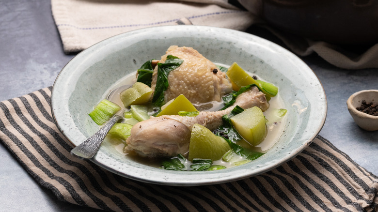 chicken tinola in bowl with spoon