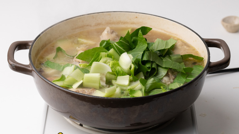 Bok choy added to pan