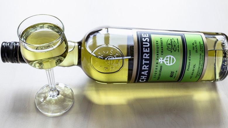 A bottle and glass of Chartreuse