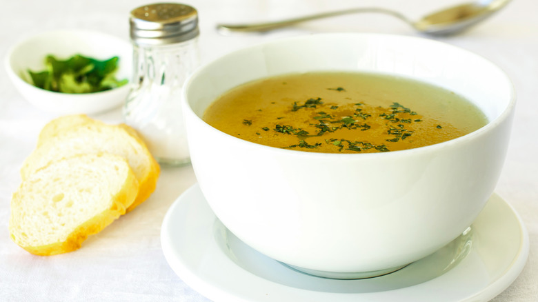 chicken broth in white bowl