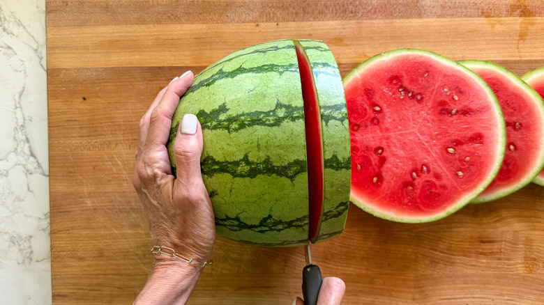 hand slicing watermelon