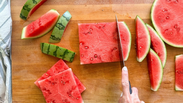 hand cutting watermelon square