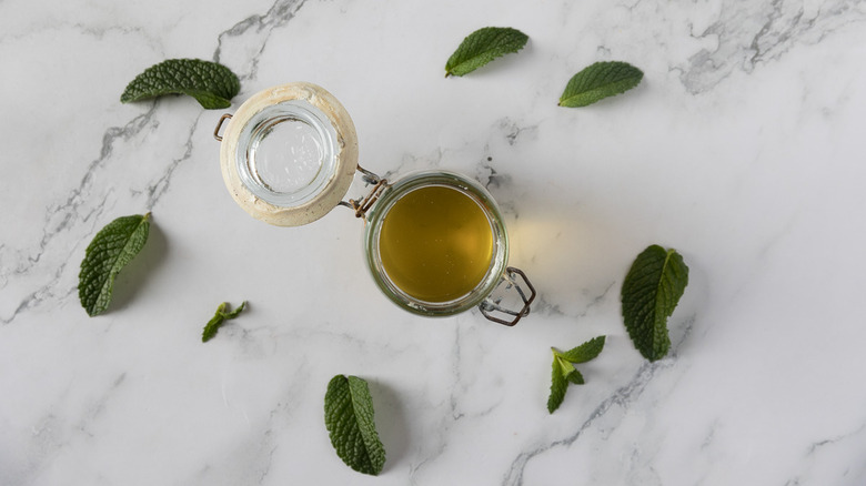 Mint simple syrup on marble background