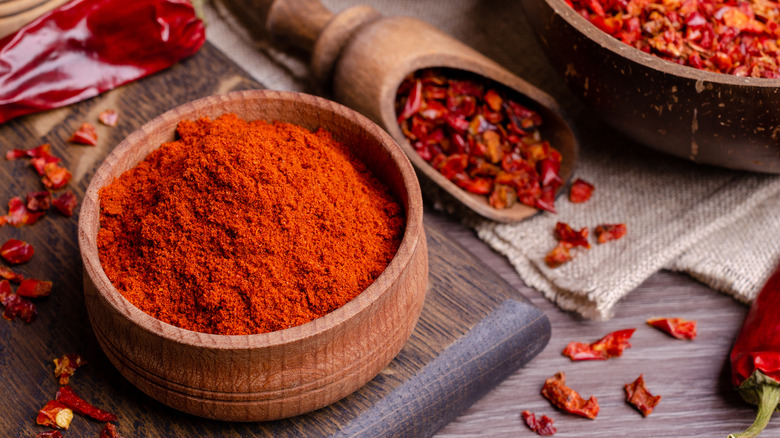 Red dried pepper on a dark wooden background