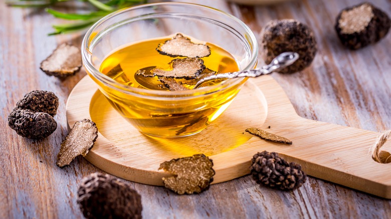 Mushroom oil on a wooden background