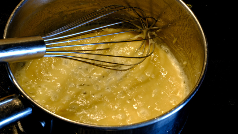 Whisking roux in pot