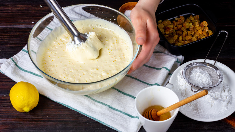 Whisking sauce in bowl