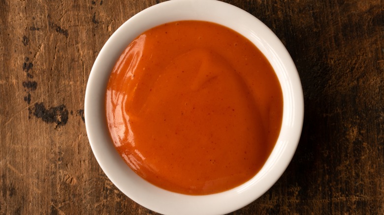 Small bowl of orange sauce