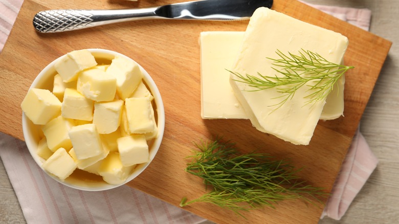 Squares of butter and green herbs