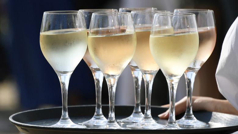 wine glasses on server tray