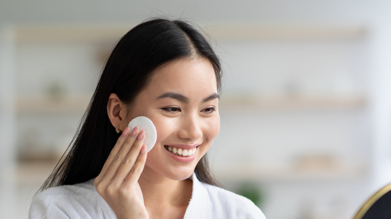 Woman applying toner