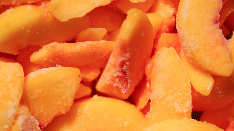 Slices of frozen peaches