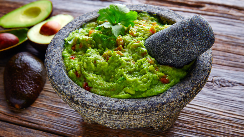 Guacamole mixed with pestle 