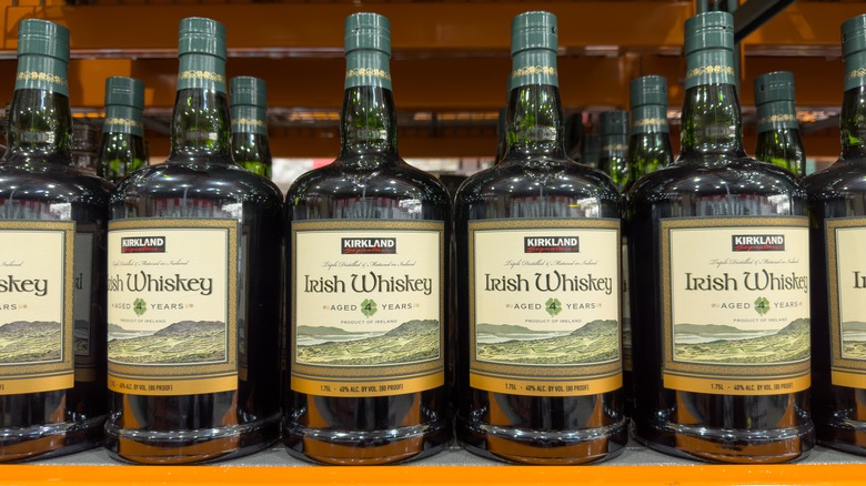 Bottles of Kirkland Signature whiskey on the shelf at Costco