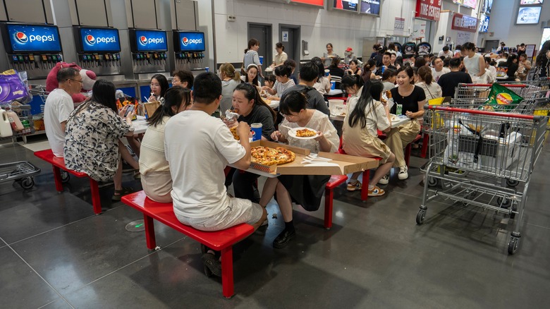 Customers eating Costco food in food court seating area