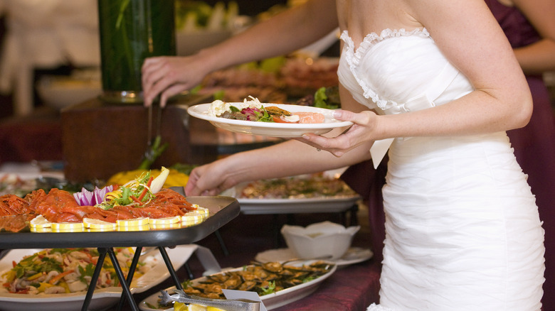 bride at a wedding buffet