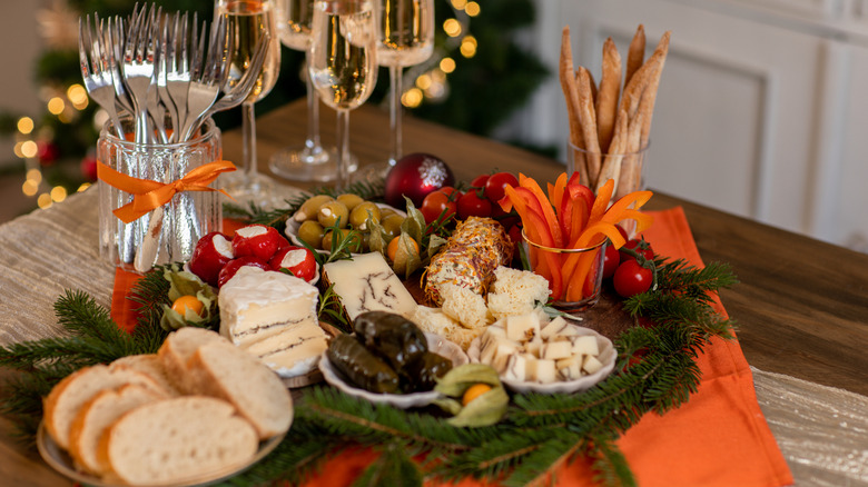 champagne and cheese board on holiday table