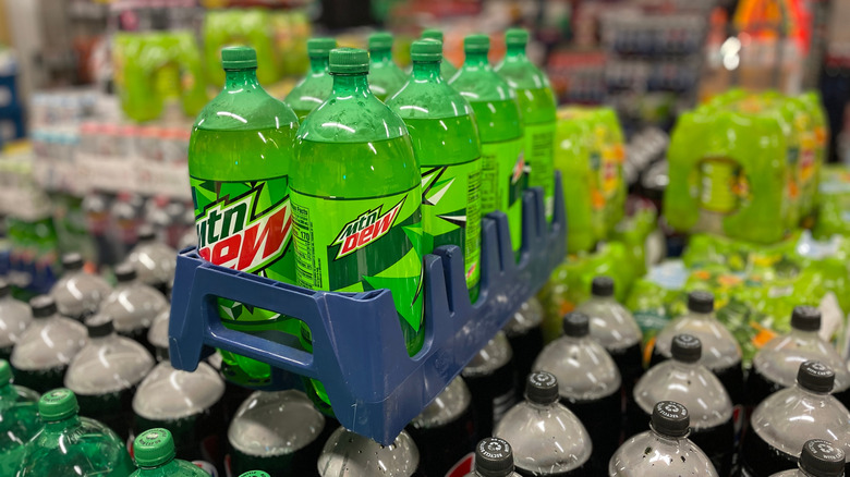 Grocery store display of two-liter bottles of Mtn Dew