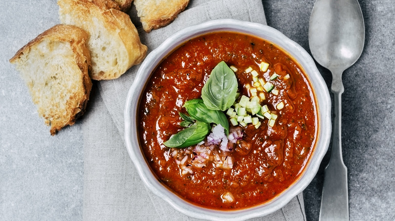 A bowl of soup and bread.