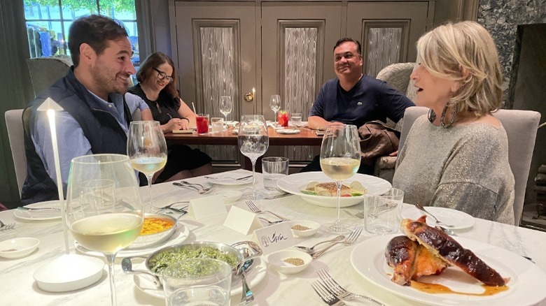 Thomas Joseph and Martha Stewart talking over lunch