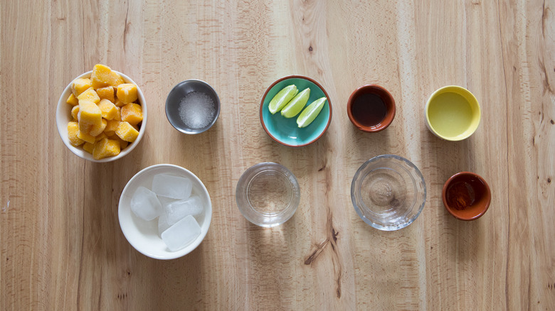 Mango margarita ingredients on table