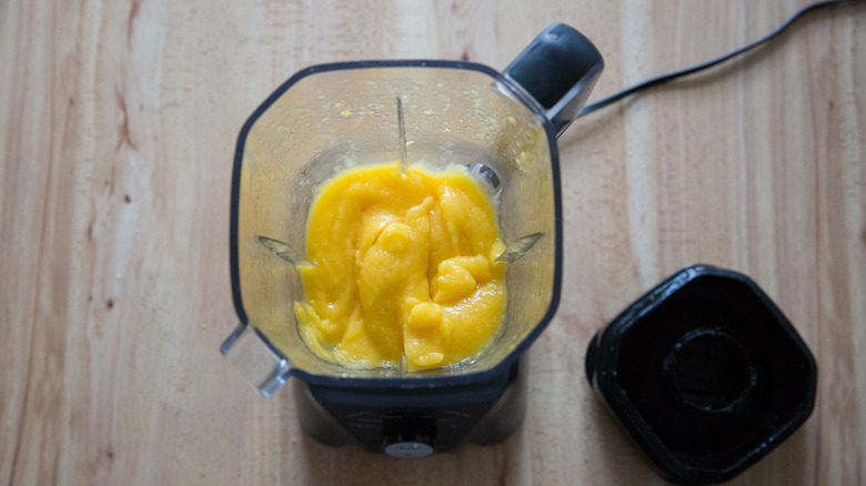 Frozen mango margarita in blender