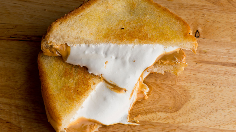 Fluffernutter sandwich on wooden surface