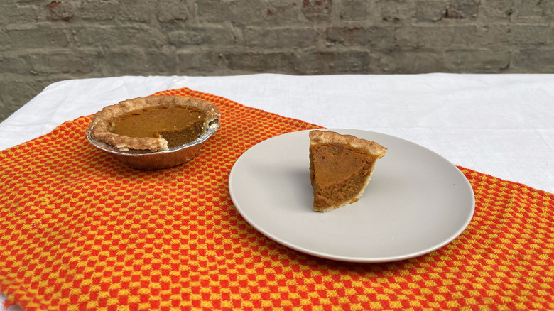 Wegmans mini pumpkin pie and slice on a plate