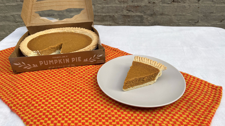 Trader Joe's pumpkin pie and slice on a plate