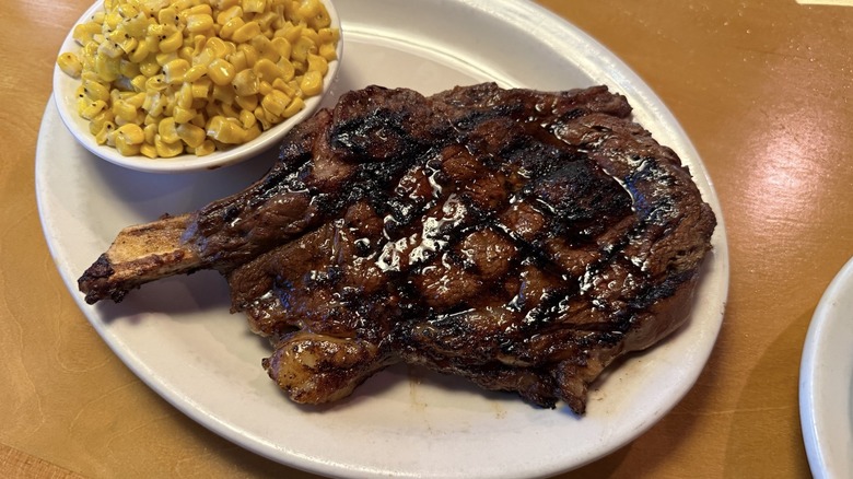 Bone-in ribeye with corn from Texas Roadhouse.