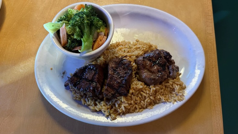 Filet medallions over rice and steamed veggies from Texas Roadhouse.