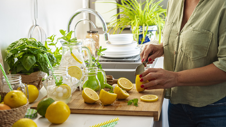 woman cutting lemons