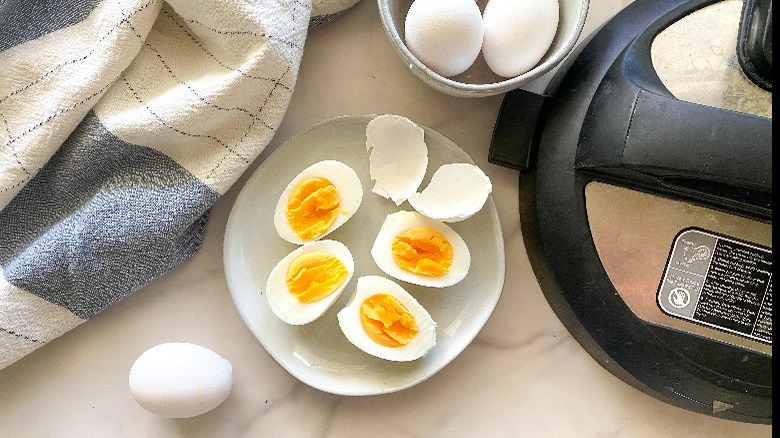 hard boiled eggs on tan plate