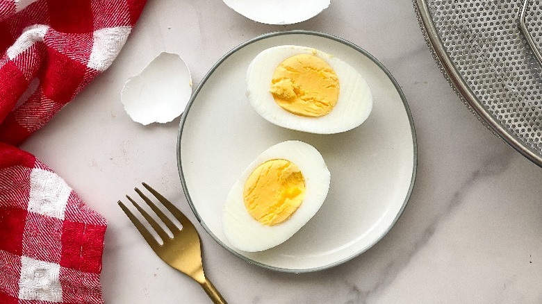 hard boiled eggs on small white plate