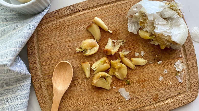 roasted garlic cloves on board