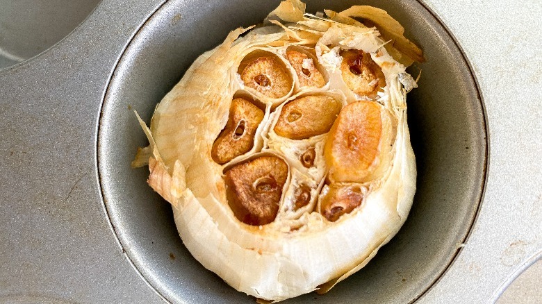 garlic bulb in muffin tin