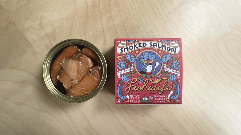 box and open tin of salmon