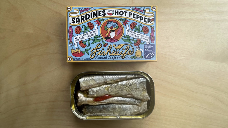 box and open tin of sardines 