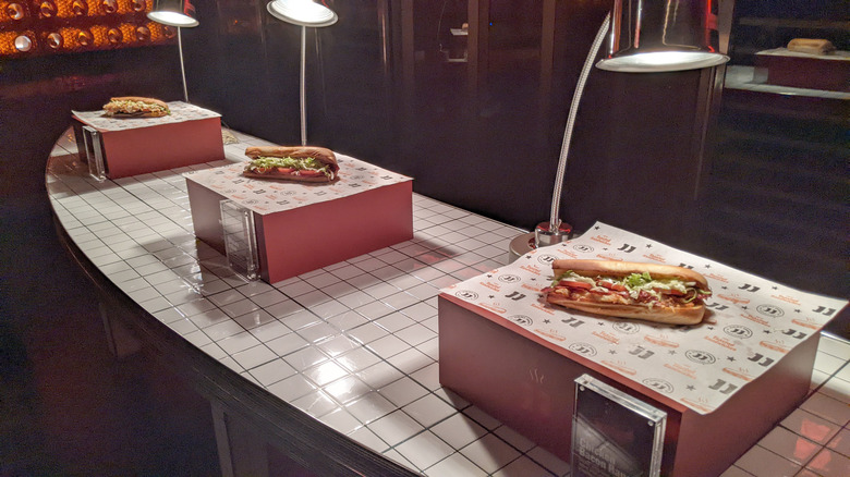 Jimmy John's toasted sandwiches under heat lamps