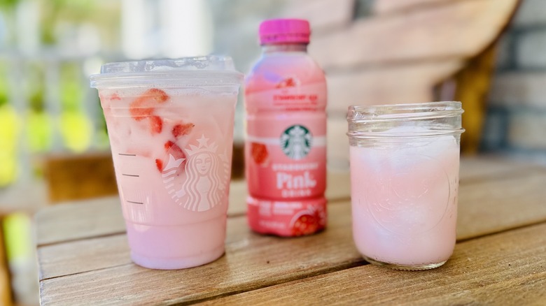 Pink Drink in cup and bottle