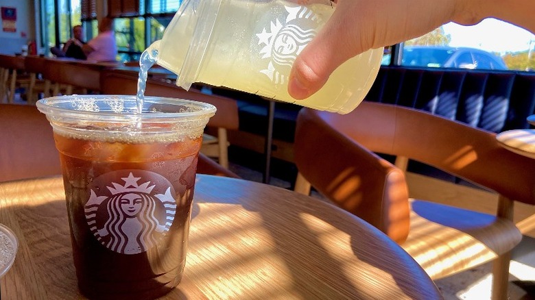 pouring lemonade into cold brew